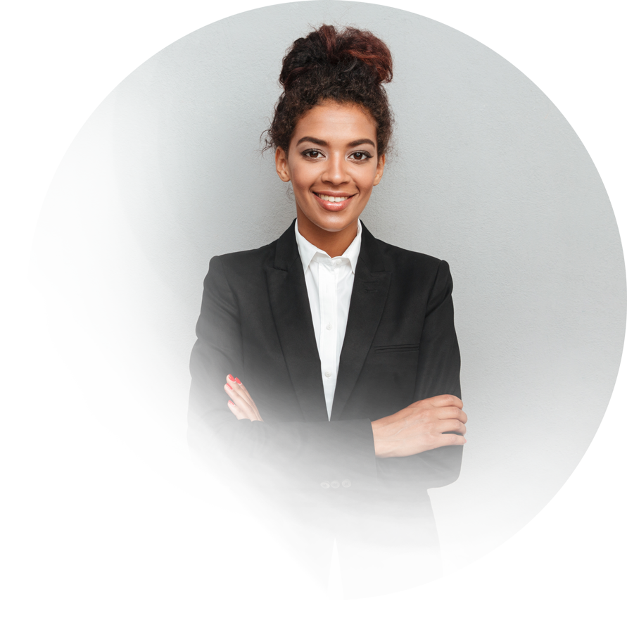 Professional working women, wearing a black suit, white shirt and posing with her arms folded.